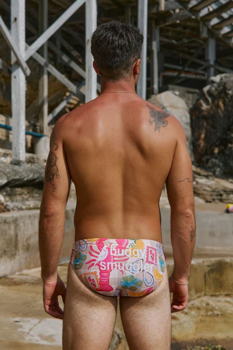 Mens swimwear with a pink check lobster pattern 